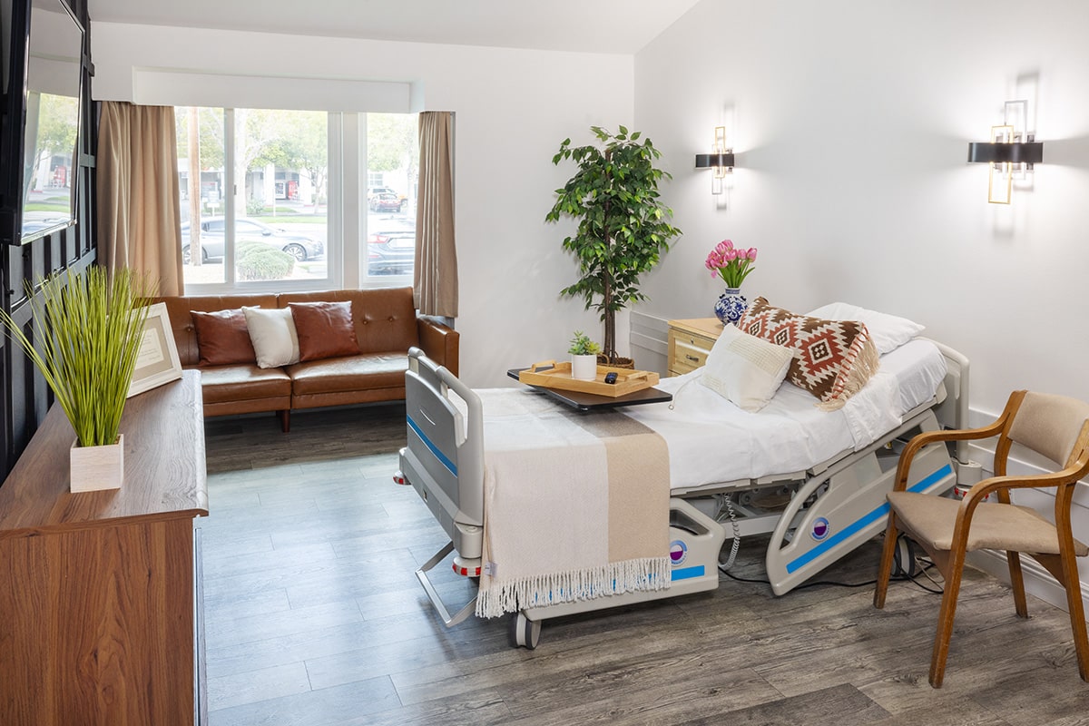 A private room with soft seating at the San Joaquin Nursing and Rehab facility