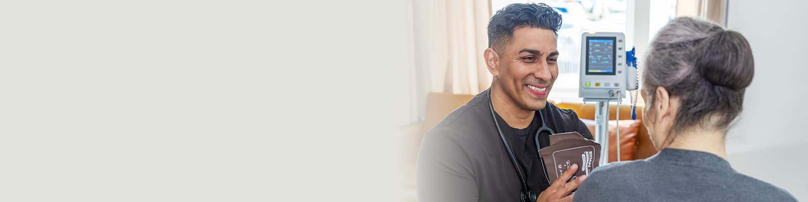 A caregiver with a resident at the San Joaquin Nursing and Rehab facility