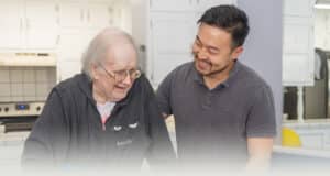 A rehab therapist with a resident at the San Joaquin Nursing and Rehab facility